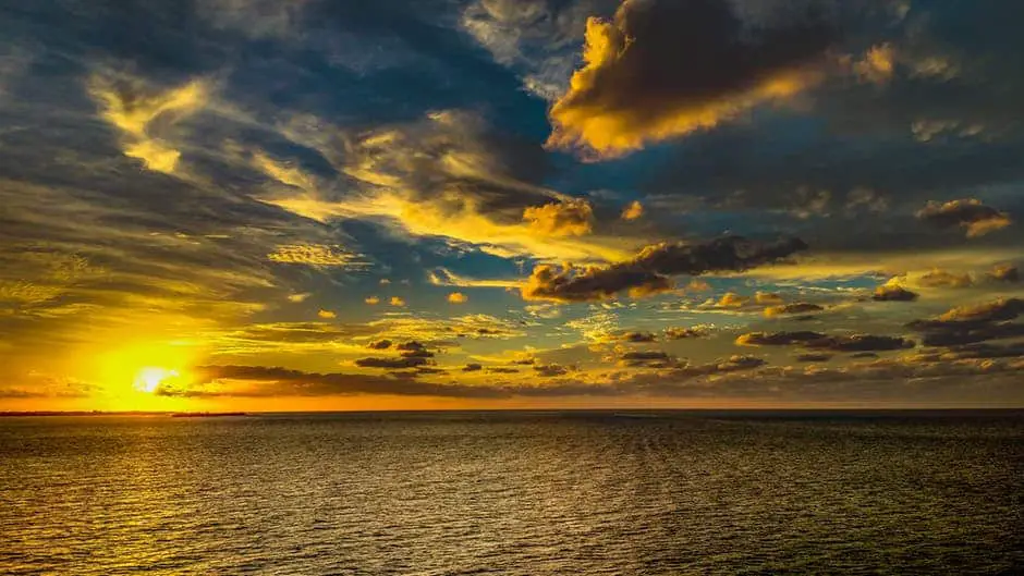 cloud turns gold at sunset